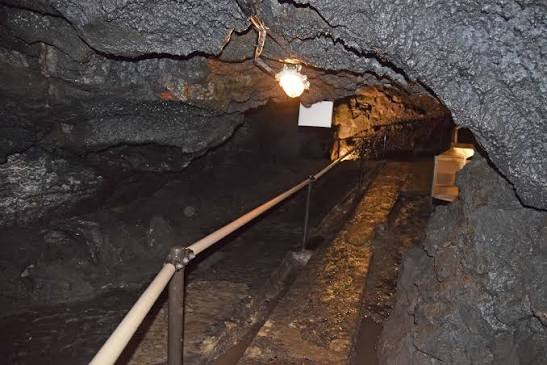 Interior of a lava cave with a safety handrail installed
