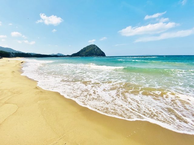 Hagi's coastline, with clear water and a green island