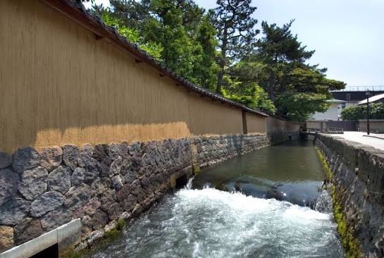 The Onosho Canal flowing past earthen walls in Nagamachi