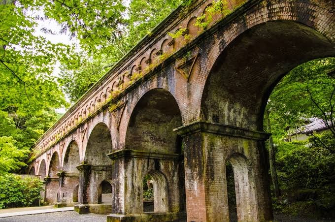 The red-brick Suirokaku aqueduct inside Nanzen-ji — still carrying water today.