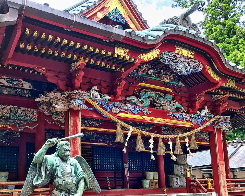 The hall of Yakuo-in on Mt Takao and its tengu statue