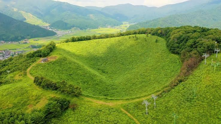 Aerial view of Mt. Kannabe and its bowl-shaped crater, Kannabe Highlands